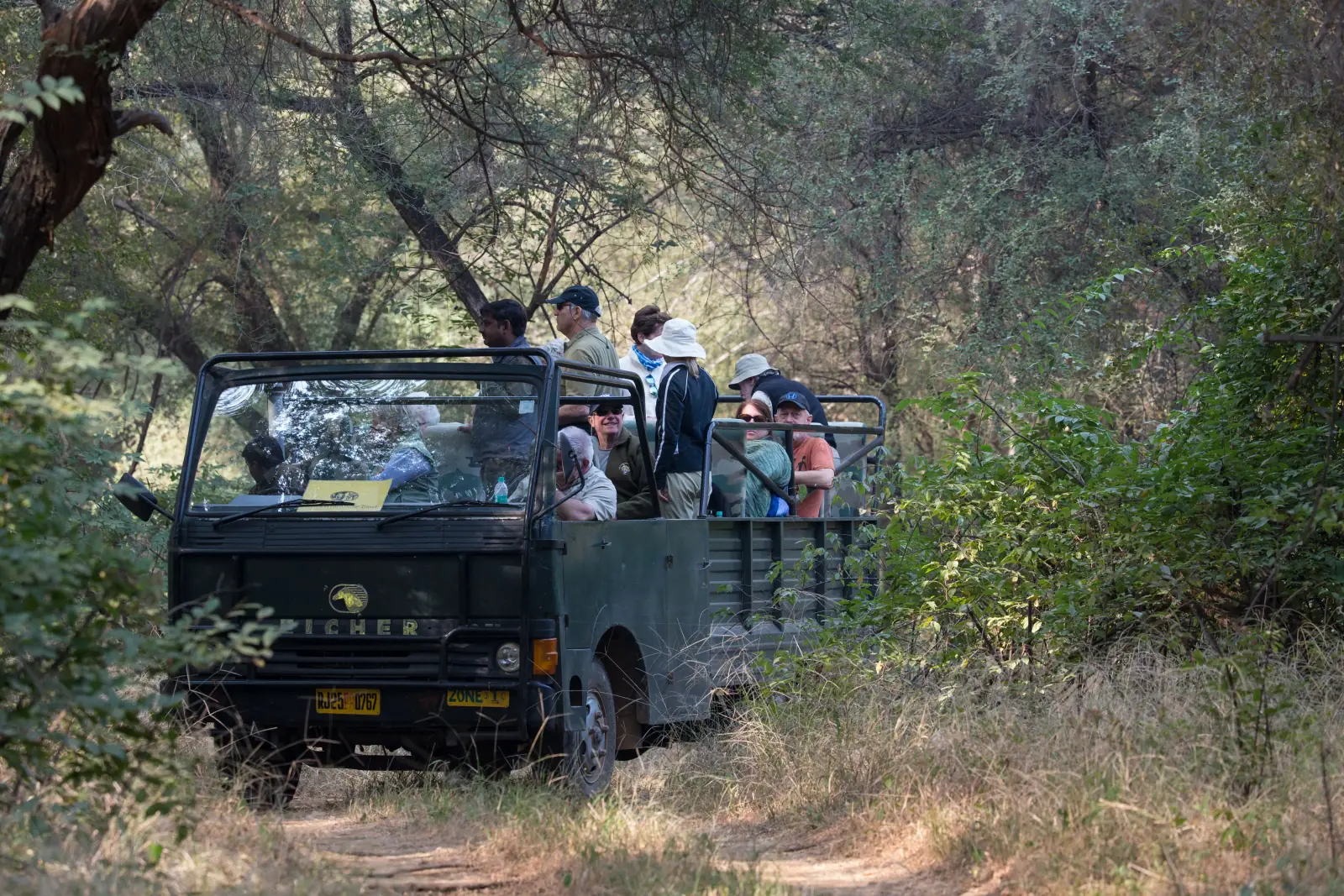 Canter safari vehicle with passengers in Ranthambore